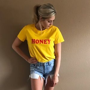 Yellow Honey Shirt with red letters